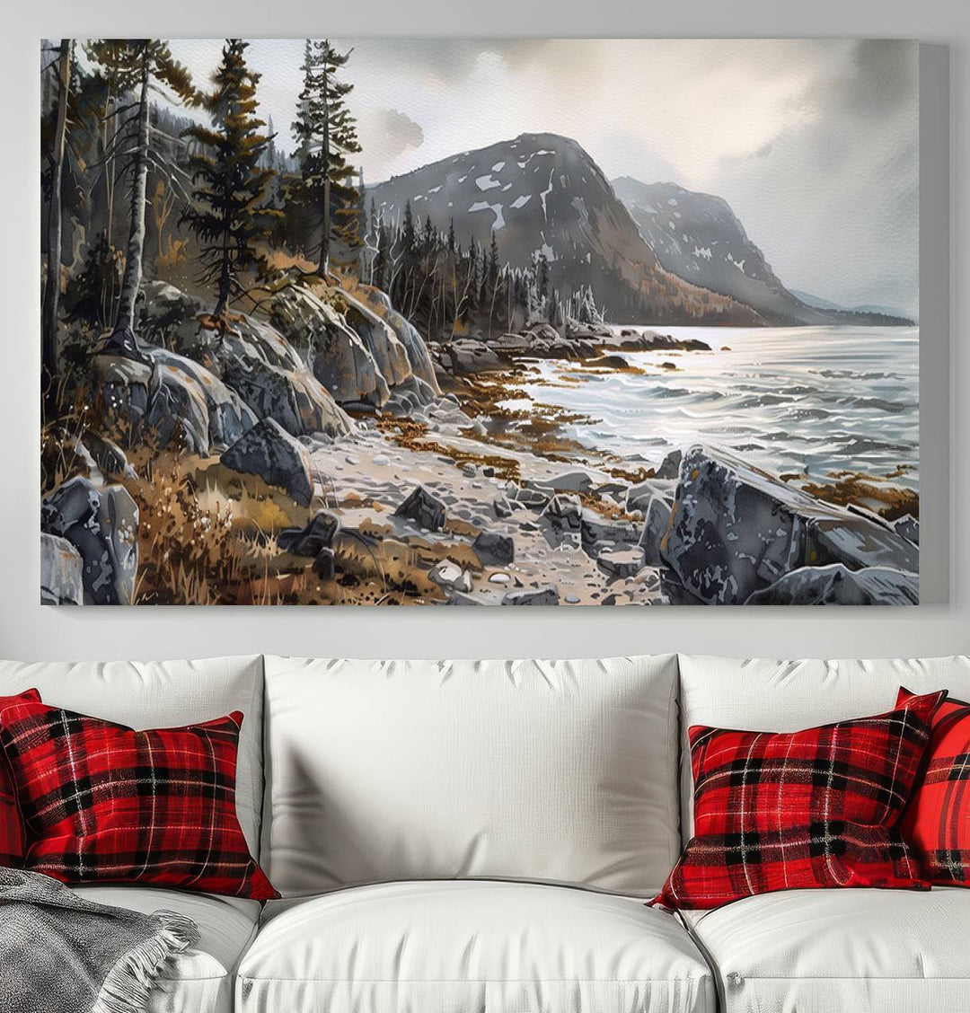 Framed wall art depicting Acadia National Parks rocky coast, trees, mountains, and sunlight over the sea; ready to hang.