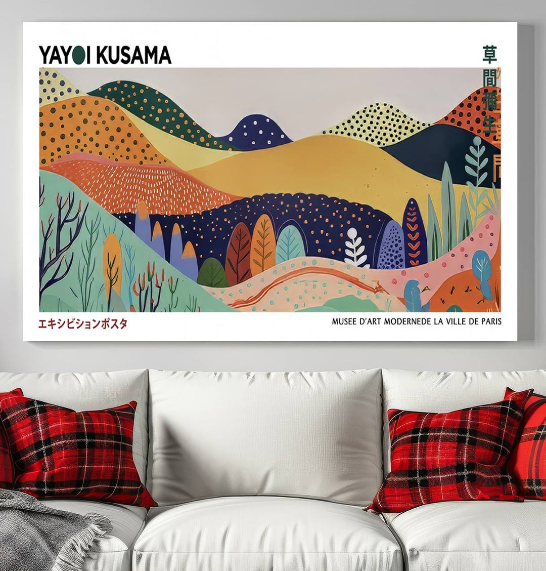 A Yayoi Kusama abstract landscape print adorns the wall.