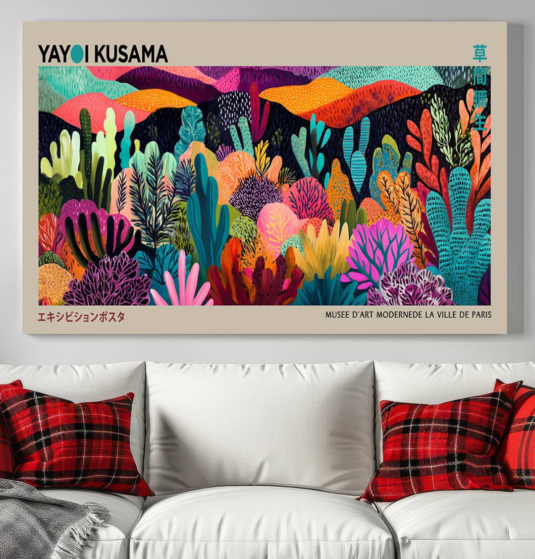 The framed Yayoi Kusama wall art adds vibrancy above the blue couch.