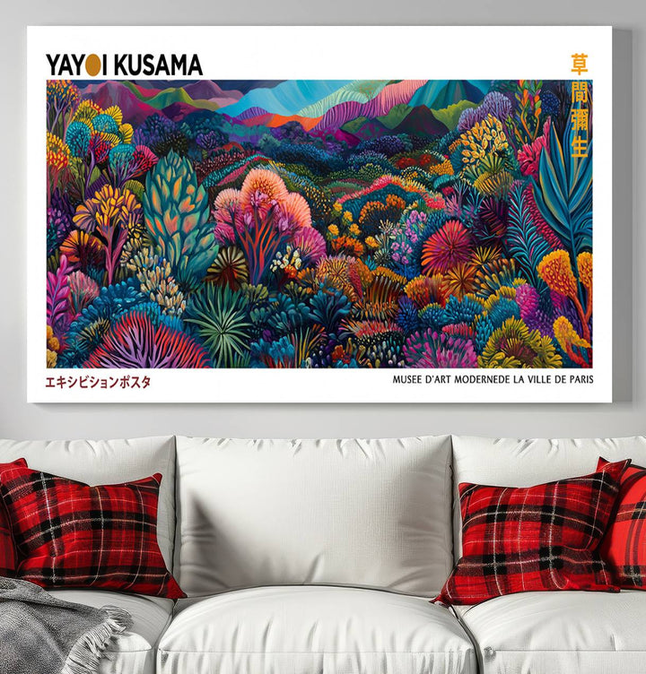 A framed Yayoi Kusama print hangs on the wall.