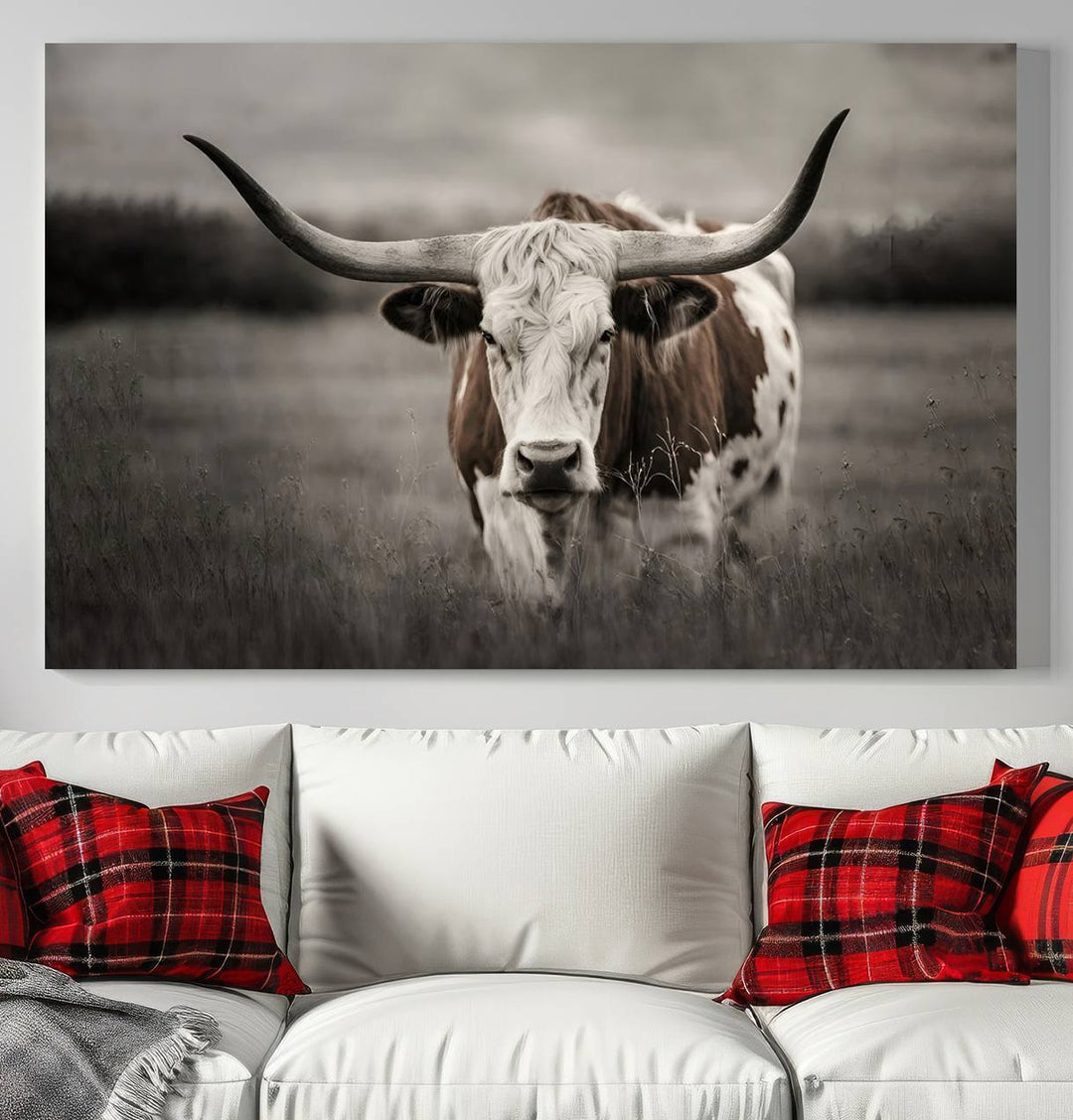 The Texas Longhorn Cow Canvas Wall Art Print adds a rustic touch to a living room.