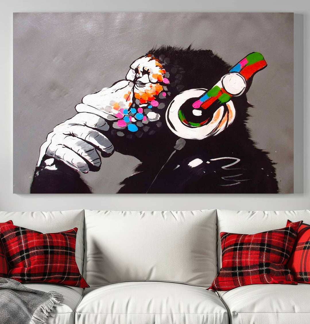 A vibrant triptych, the "DJ Monkey Listening to Music" wall art print, features a Banksy-inspired large canvas adorned with colorful modern pop art. This striking piece elegantly enhances the room with its dynamic and lively depiction.