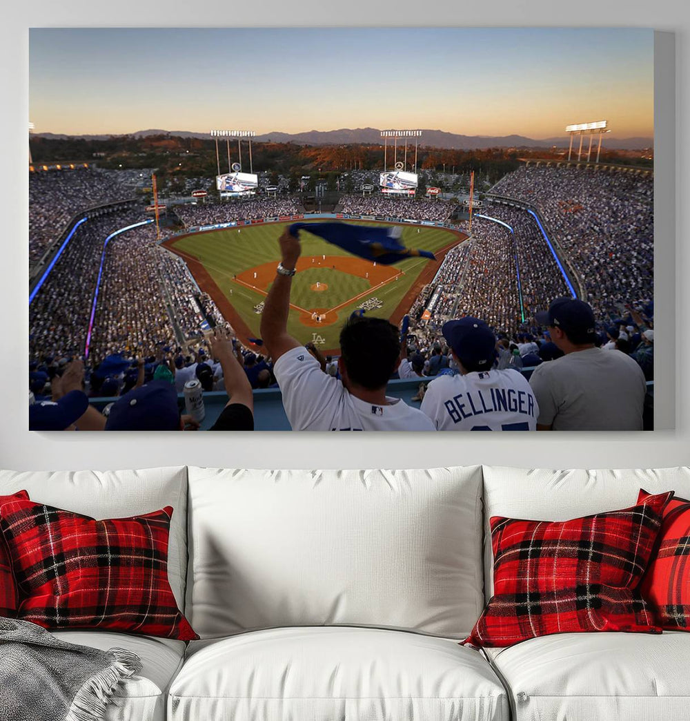 A triple canvas wall art captures the scene at Dodger Stadium, with fans cheering as the sun sets and a flag waving on the field.