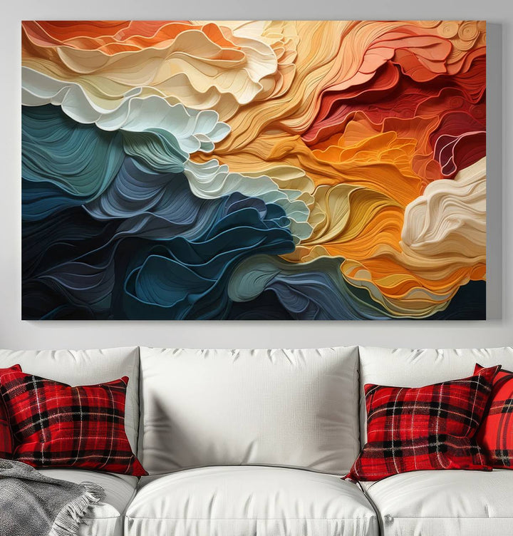 A Blue Orange Abstract Wave Wall Art Canvas Print adorns the wall. This colorful masterpiece is professionally hand-assembled to enhance any space.