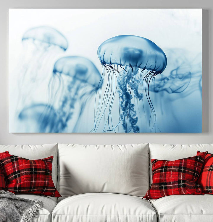 A breathtaking triptych of the Blue Jellyfish Wall Art Canvas Print decorates the space, beautifully highlighted by an overhead lamp. Each canvas is created on museum-quality material using high-resolution printing and includes a UV-protective coating to ensure long-lasting vibrancy.