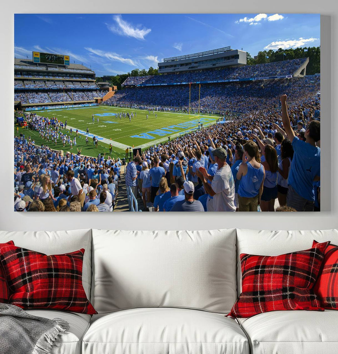 A gallery-quality canvas wall art print featuring the University of North Carolina Tar Heels Football Team and Chapel Hill's Kenan Memorial Stadium adorns the cafe wall.