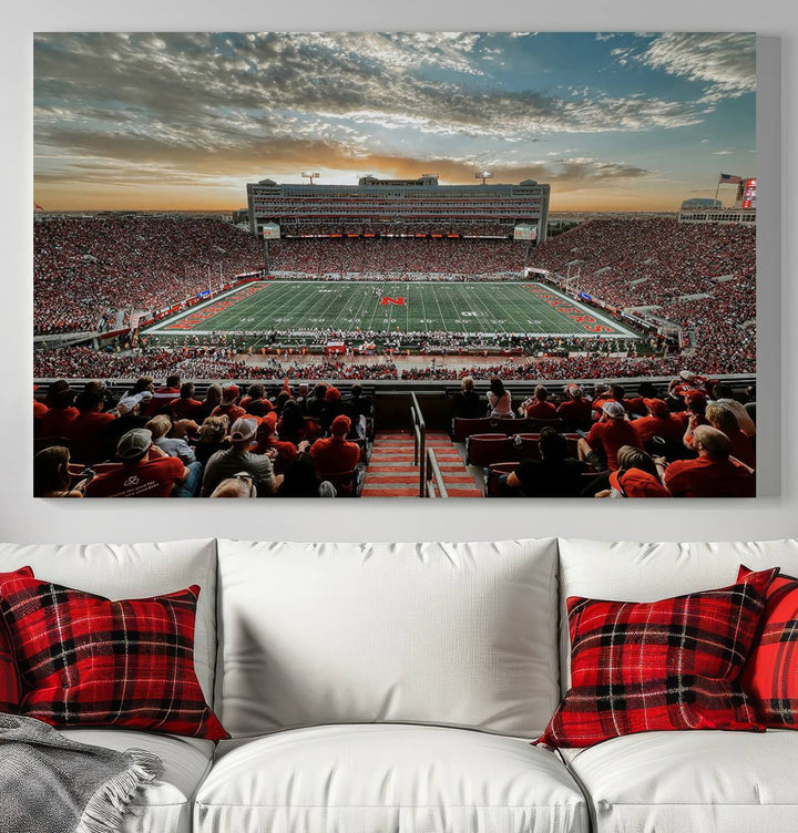 The living room features a stunning triptych of Lincoln Memorial Stadium wall art canvas print, celebrating the University of Nebraska Cornhuskers football team. This piece serves as captivating wall art, showcasing a gallery-quality finish.