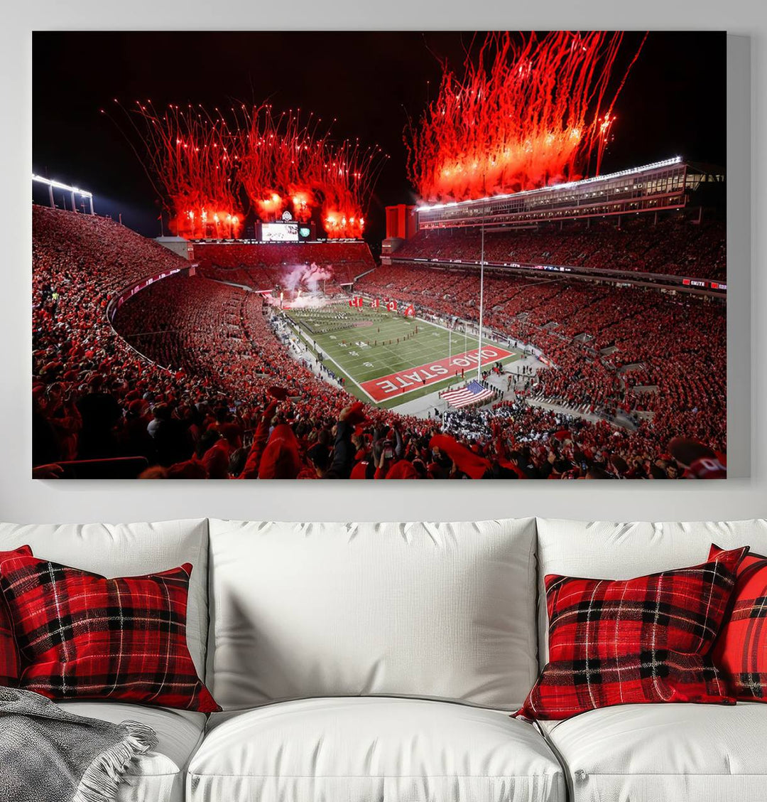 A vibrant red canvas art of a packed Ohio State Buckeyes stadium at night with fireworks.