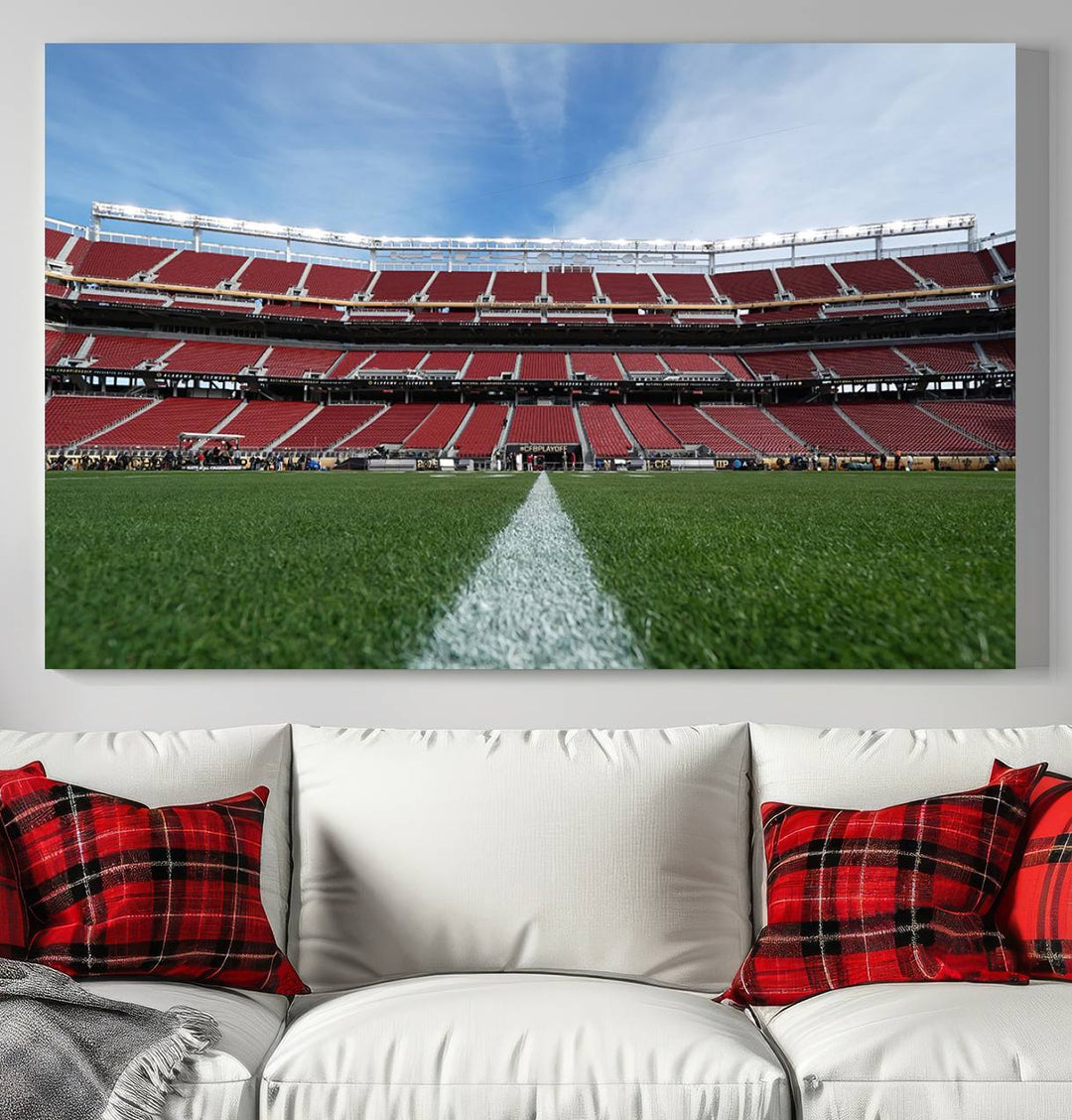 A canvas print of the University of Tulsa Golden Hurricane showcases H.A. Chapman Stadiums football field and red seats against a backdrop of a blue sky.