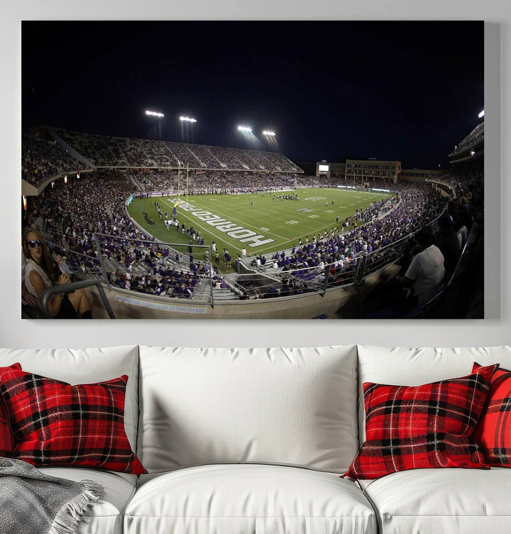 The wall art print features a night view of Amon G. Carter Stadium filled with TCU fans, showcased in the Horned Frogs Football Canvas Wall Art.