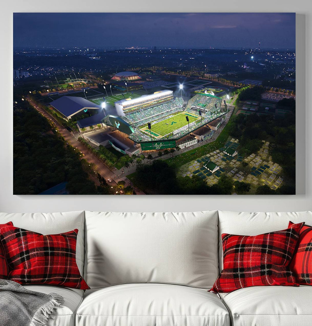 The USF Bulls Football Team Wall Art Canvas Print showcases the Tampa USF Football Stadium at night with city lights.