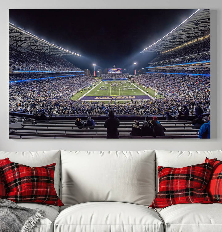 A canvas print titled The University of Washington Huskies Football depicts a packed Husky Stadium at night, as seen from the stands.