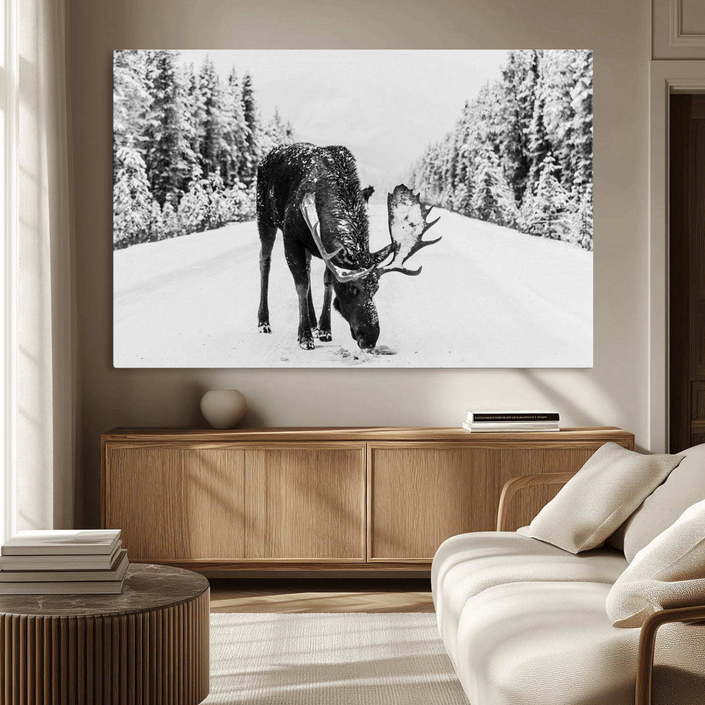 A majestic moose grazing in the snow-covered wilderness, surrounded by snow-covered trees, creating a peaceful winter scene.