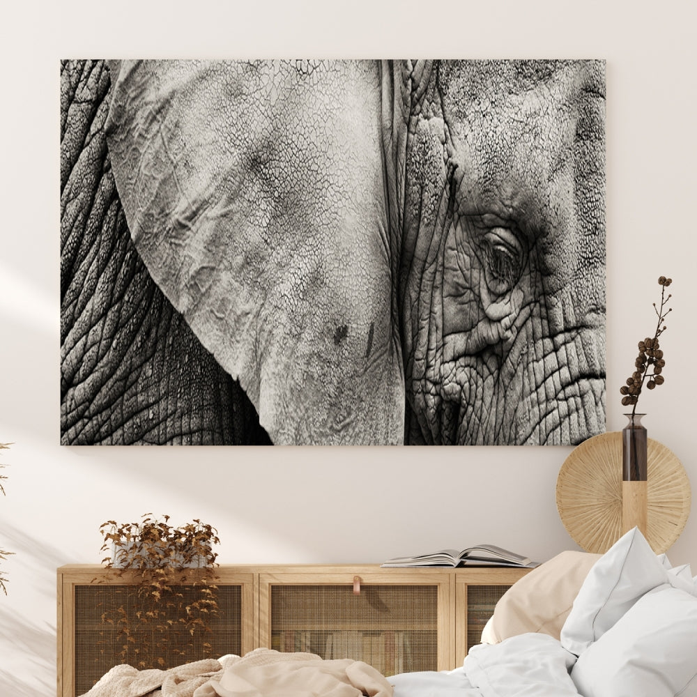 A modern living room features a large Elephant Wall Art Canvas Print in black and white, crafted on museum-quality canvases with UV-protective coating to maintain its elegance.