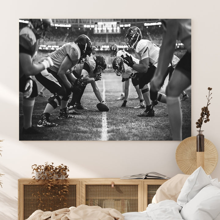 The "American Football Match Wall Art Canvas Print," featuring a black and white photo of a football game, is displayed as a triptych. This artwork is printed on museum-quality canvases and protected with a UV-coating.