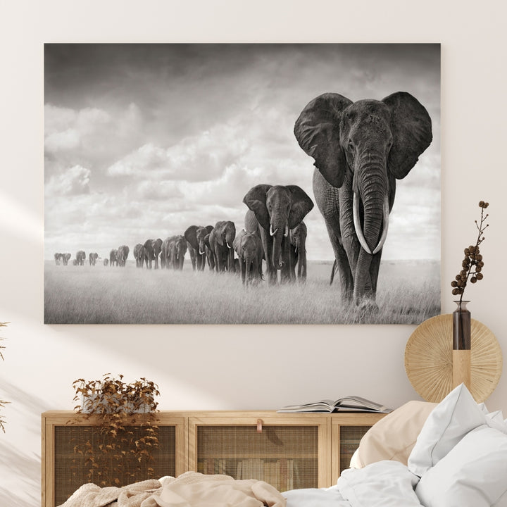 The "Herd of Elephants Wall Art Canvas Print" features an elegant black and white triptych of elephants walking in a line, beautifully displayed on museum-quality canvas with a UV-protective coating. This artwork arrives ready to hang and adds sophistication to any space.