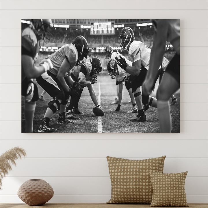 The "American Football Match Wall Art Canvas Print," featuring a black and white photo of a football game, is displayed as a triptych. This artwork is printed on museum-quality canvases and protected with a UV-coating.