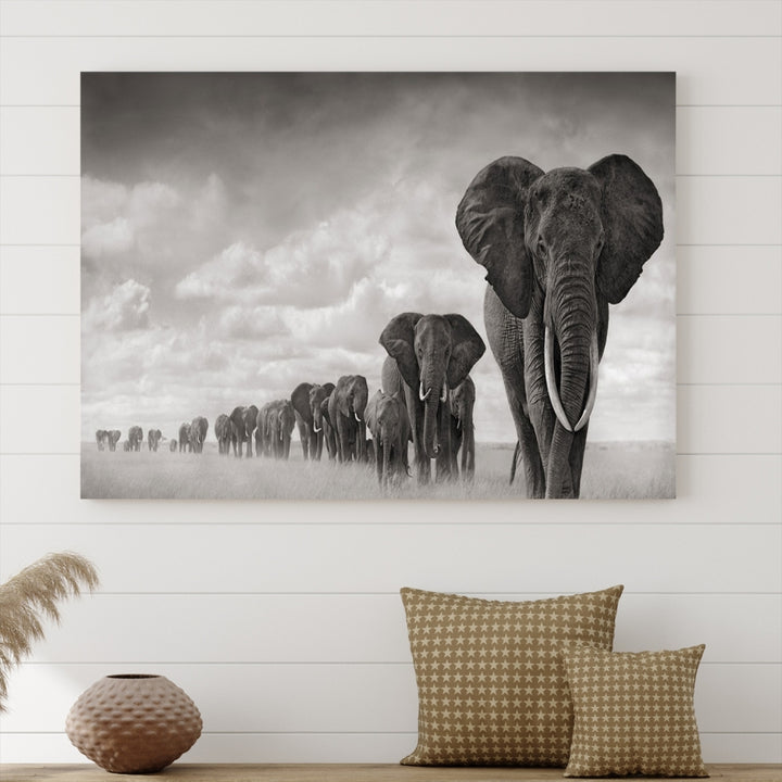 The Elephant Wall Art Canvas Print features a triptych of elephants in a savanna, elegantly displayed.