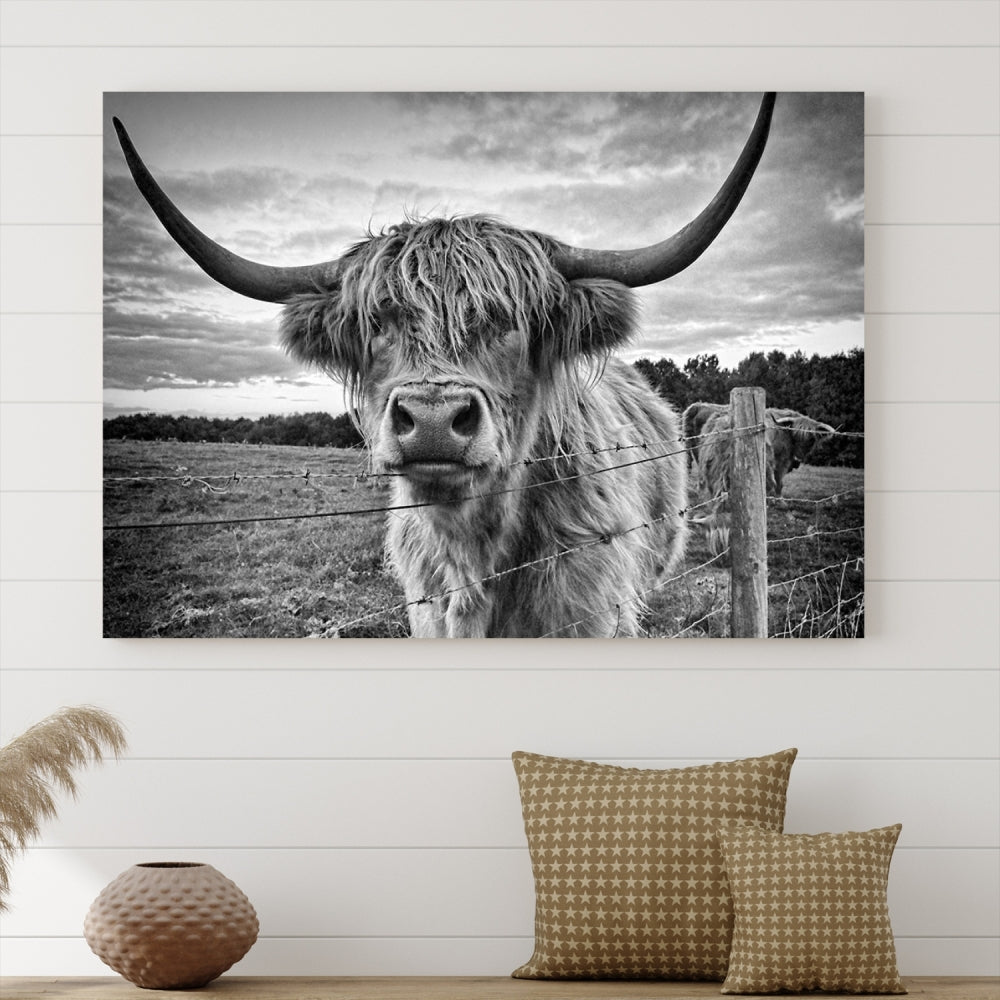 The "Scottish Highland Cow Canvas Wall Art Farmhouse Decor" adds a touch of rustic charm to your living room wall above the couch.