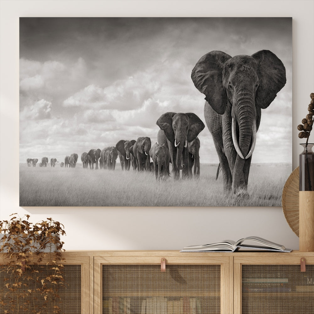 The Elephant Wall Art Canvas Print features a triptych of elephants in a savanna, elegantly displayed.