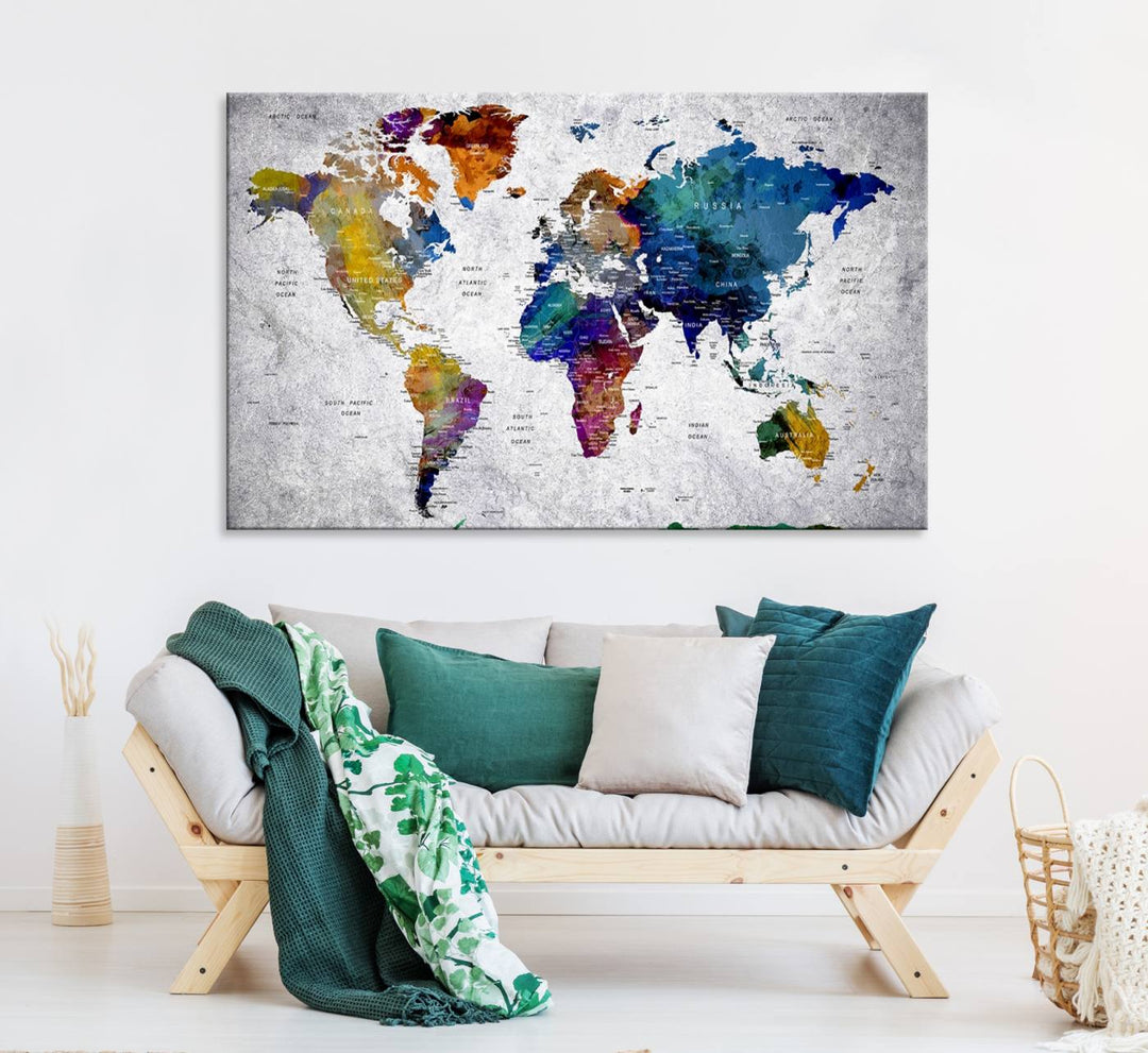 The World Map Art Canvas Print, featuring country names on a grunge-stained gray background, is perfect for stylish home decor.