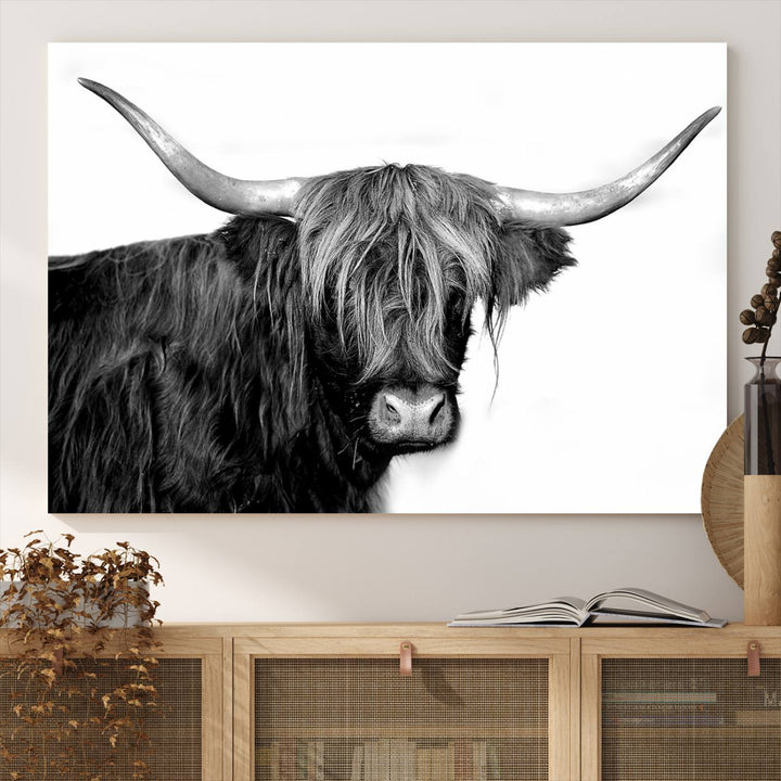 The Black and White Highland Cow Multi Panel Wall Art Canvas Print with UV-protection hangs prominently.