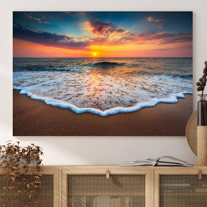 A Sunset with Calm Waves on the Beach Wall Art Canvas Print adorns the dining room.