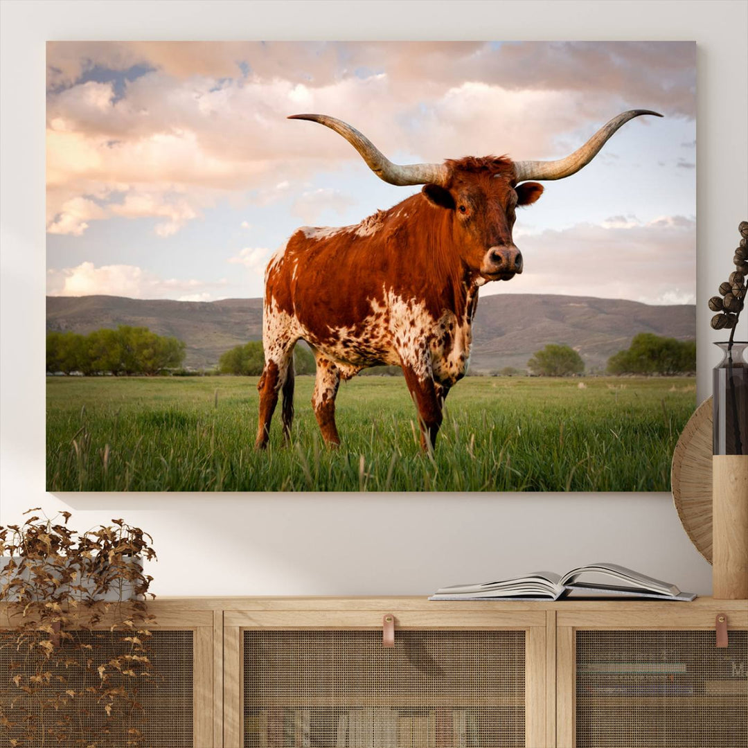 The Texas Cow Canvas Wall Art print captures a longhorn cow at sunset and is ready to hang.