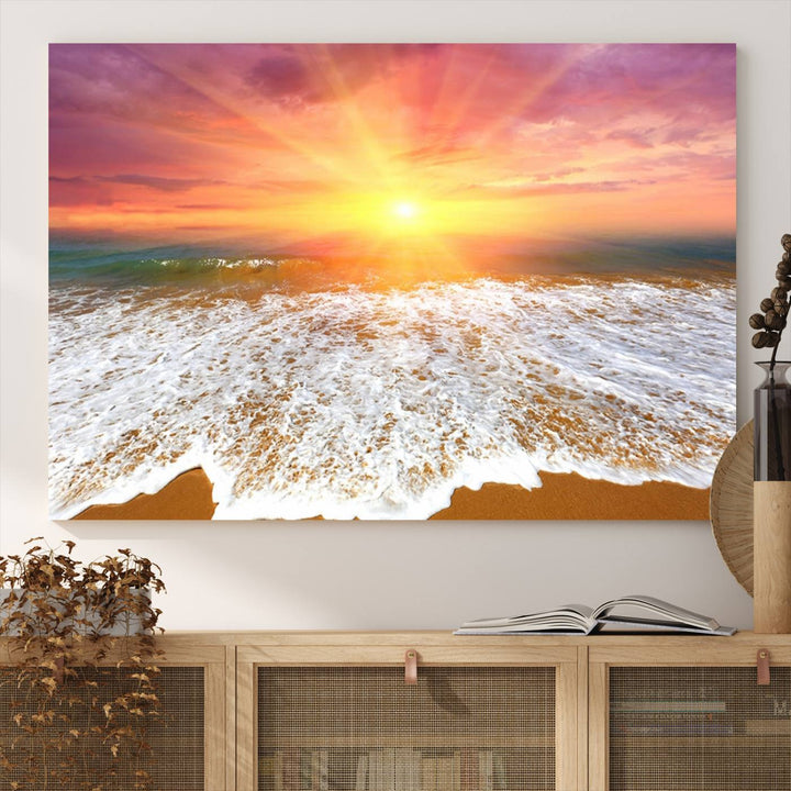 Golden Beach Sunrise 3-panel canvas art of ocean waves, hung on a wooden wall.