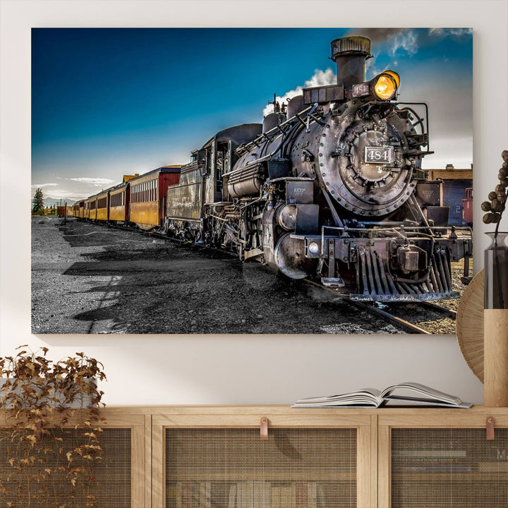 The Train Wall Art Canvas Print features a vintage steam train with a bright headlight.