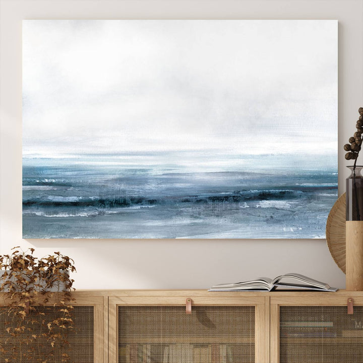 The dining area features Blue Ocean Abstract Artwork on canvas.