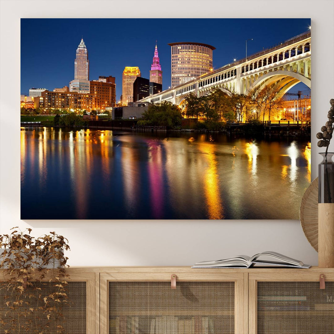 Cleveland Night Skyline Canvas: Cityscape with an illuminated bridge reflecting on calm water.