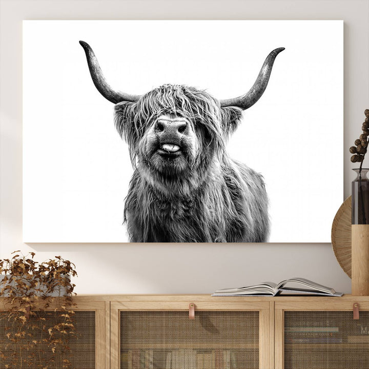 The Fanny Highland Cow art print decorates the modern kitchen, featured in black and white.