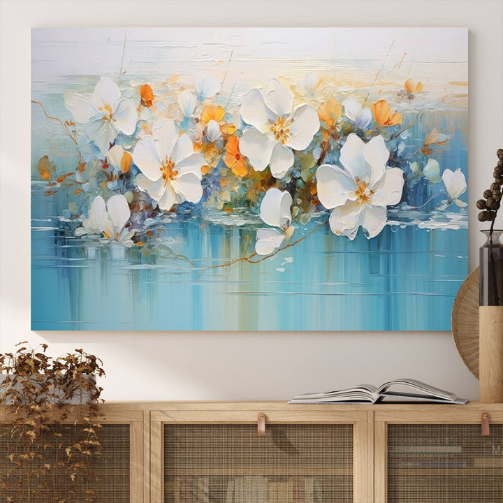 An Abstract Flower Wall Art Canvas Print in blue and orange hues.