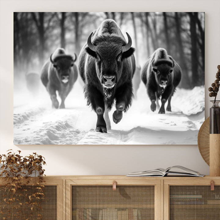 The Buffalo Wall Art Canvas Print of bison running through snow adorns the wall.