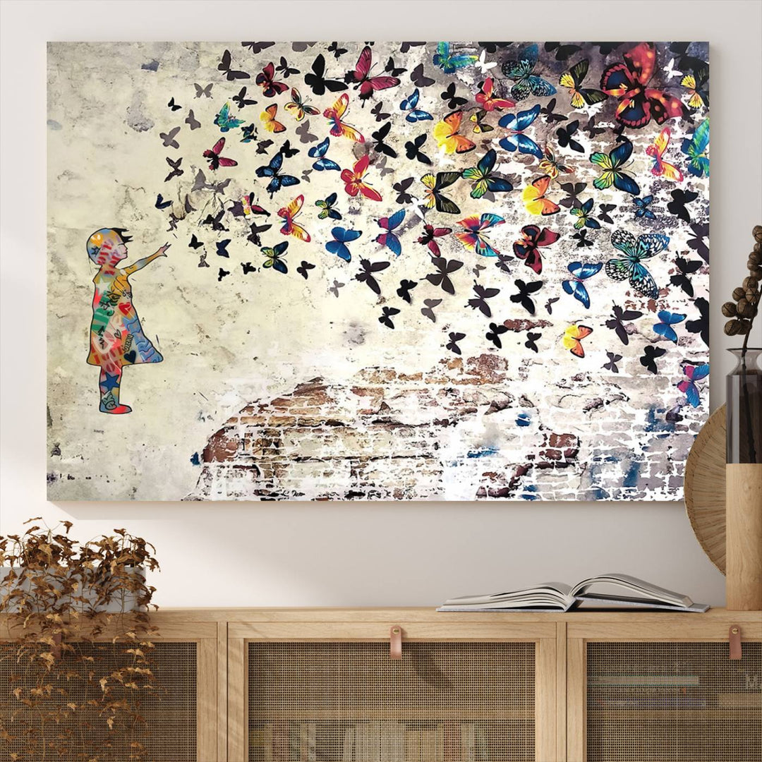 A Banksy Girl Butterfly Canvas Print is displayed on the textured wall.