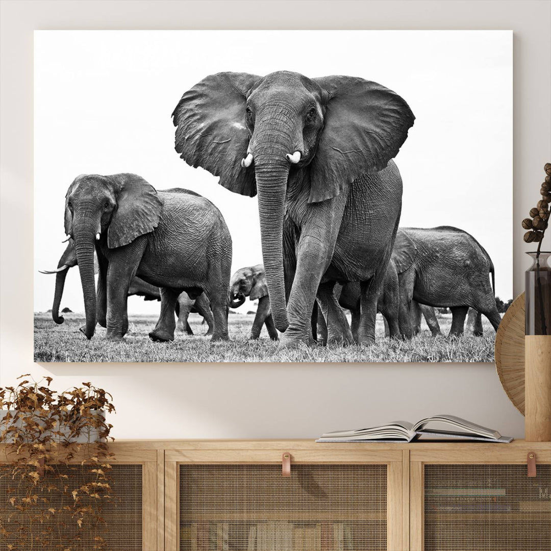 A modern dining area features a Black White Elephant Family Wall Art Canvas Print.