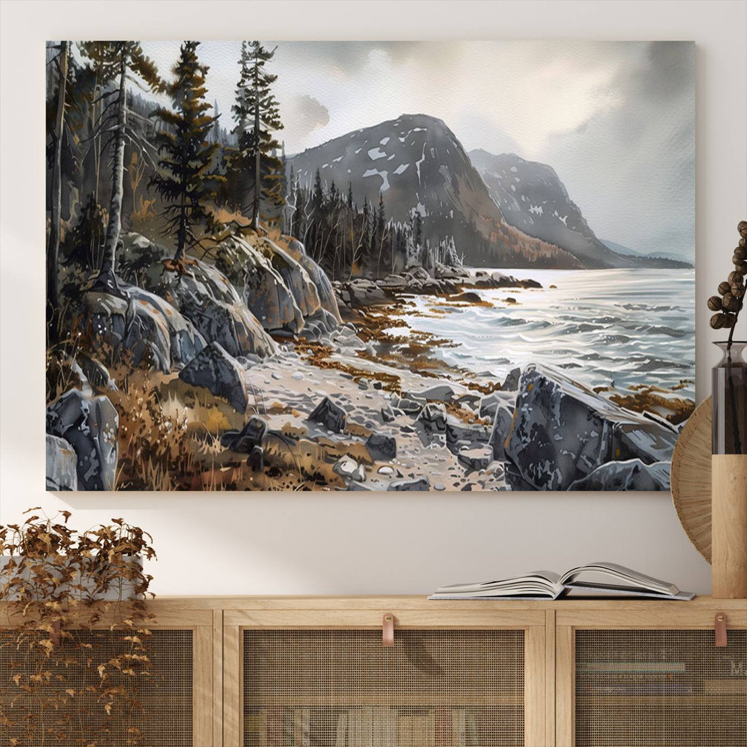 Framed wall art depicting Acadia National Parks rocky coast, trees, mountains, and sunlight over the sea; ready to hang.