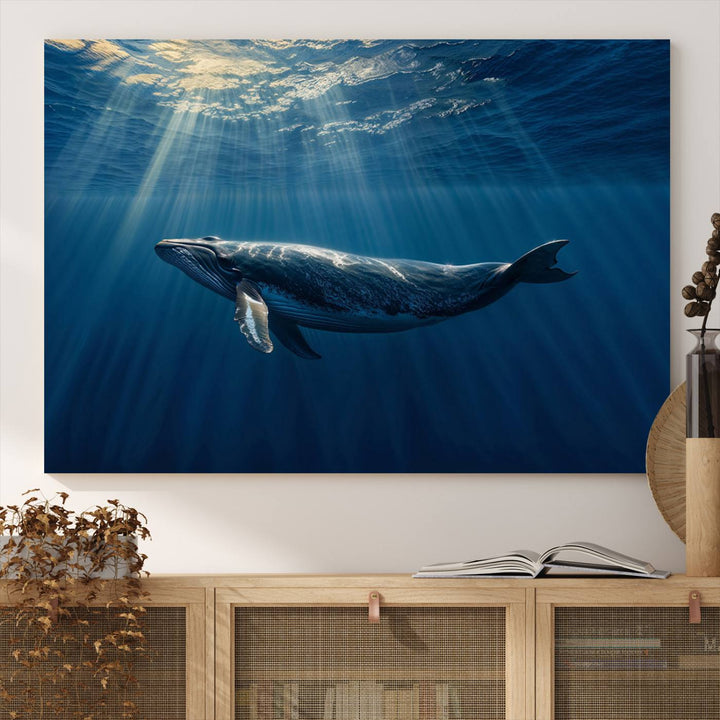 The Whale under Ocean wall art canvas print graces the white wall.