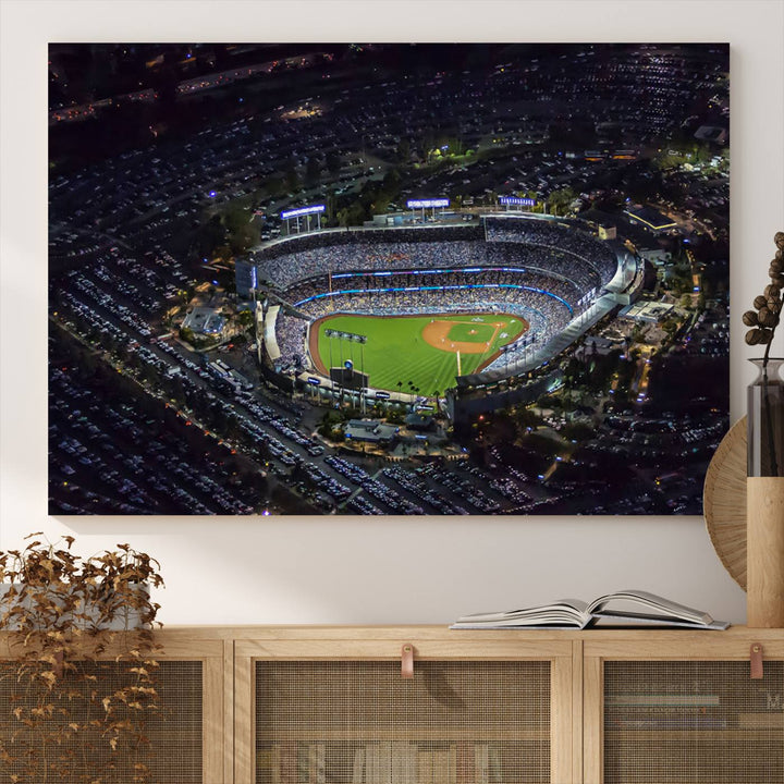 A large Los Angeles Dodgers print of Dodger Stadium at night is displayed near a window.