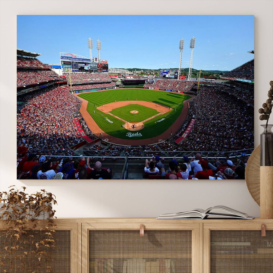 The Cincinnati Reds Baseball Team print of Great American Ball Park Stadium adorns the wall.