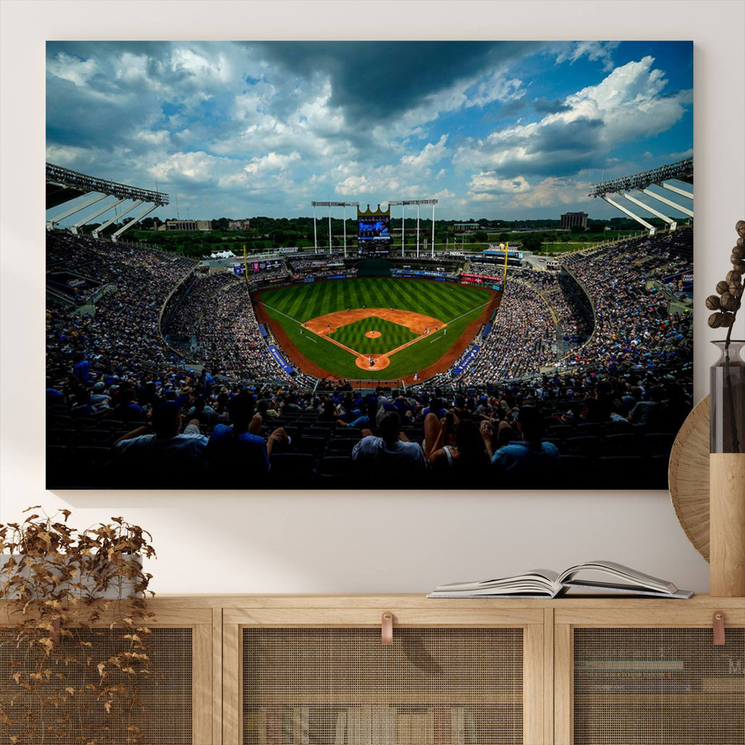 A 3-panel print of Kauffman Stadium, showcasing a crowded baseball field under cloudy skies.