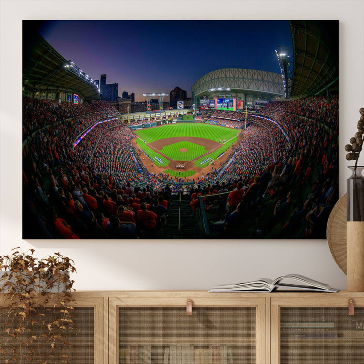 A canvas print of Houston Minute Maid Park at dusk is mounted on the wall.