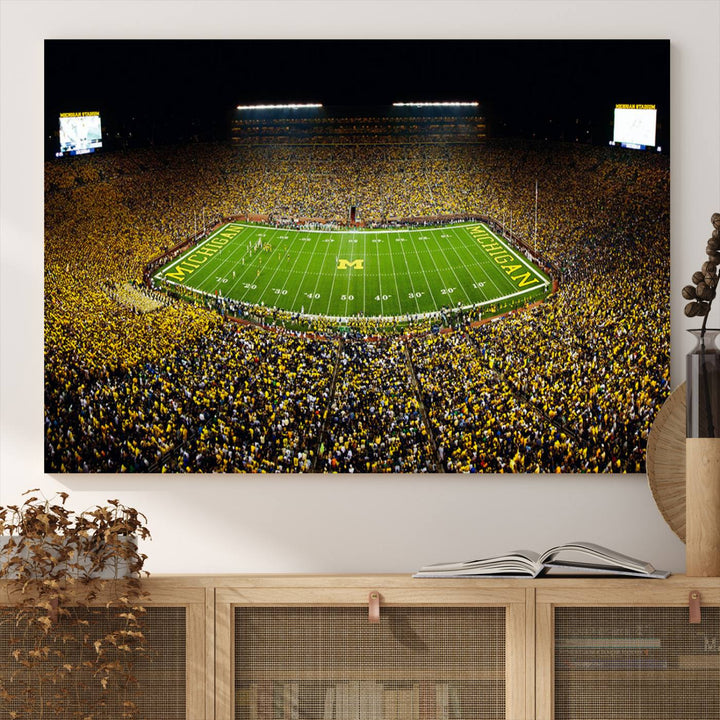 Aerial view of Michigan Stadium night game, ideal for Michigan Wolverines Football Team displayed on a triple canvas wall art.