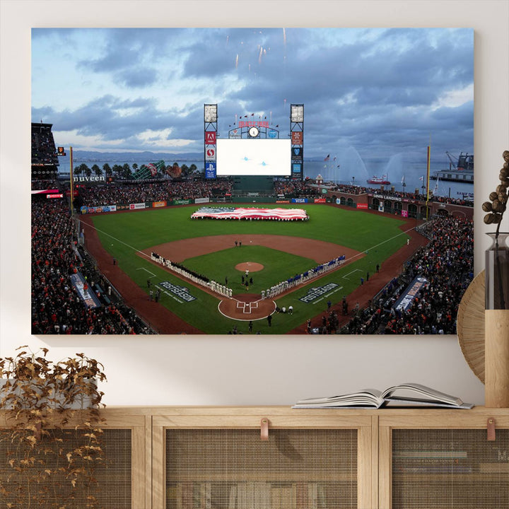 This framed 3-panel canvas MLB wall art features a giant flag and fans under a cloudy sky at Oracle Park.