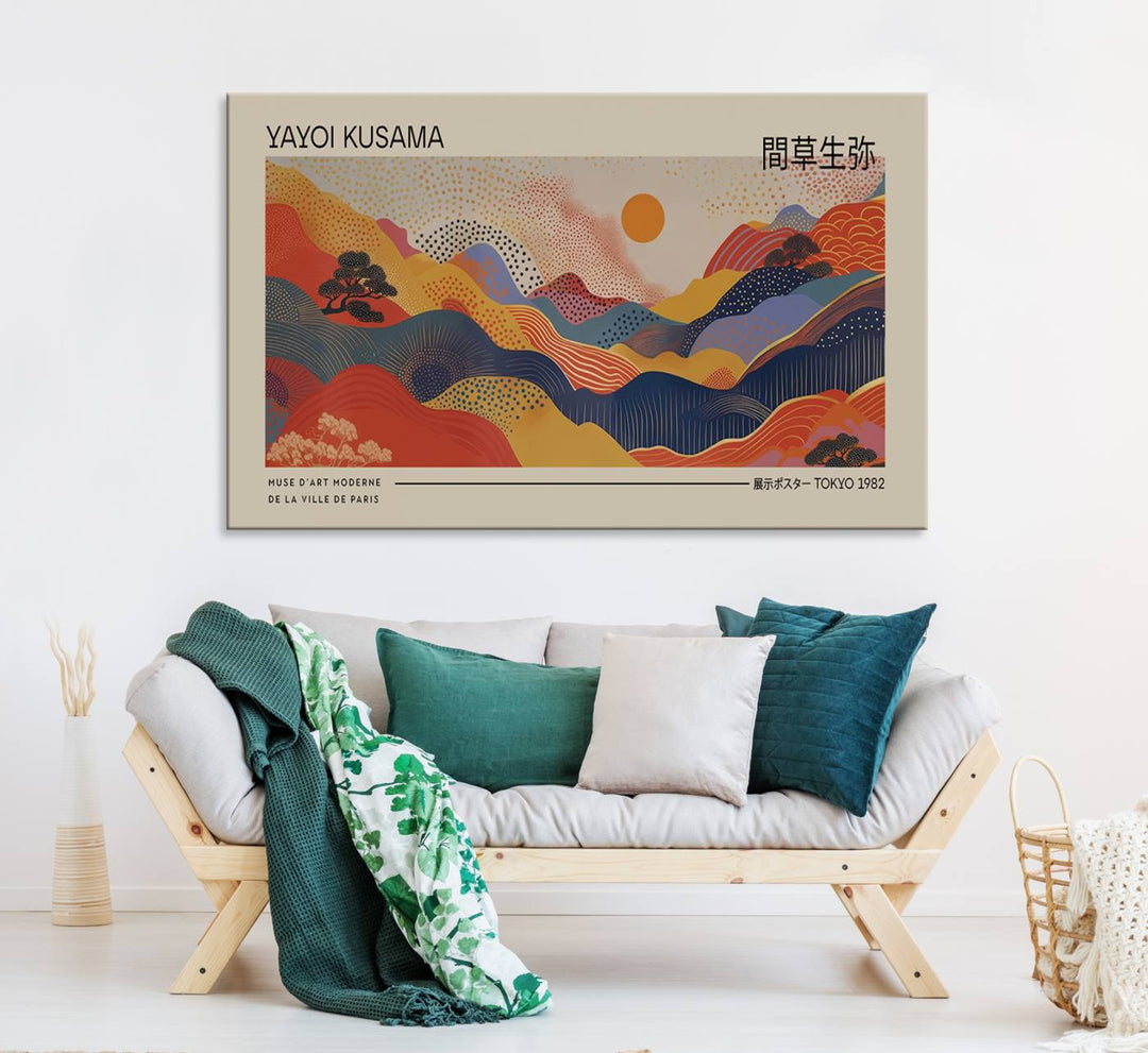 The Yayoi Kusama vibrant landscape canvas print featuring abstract mountains and a sun enhances the space with its modern aesthetic.