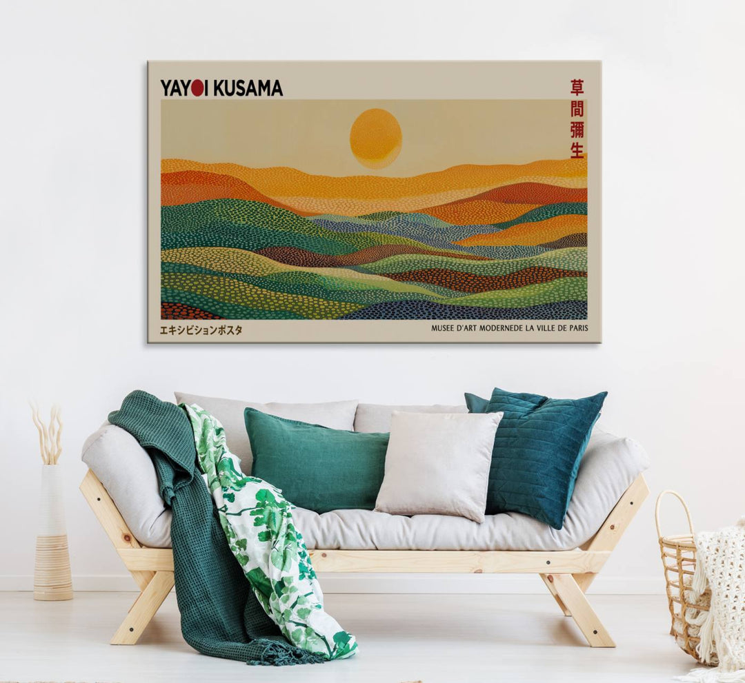 A framed Yayoi Kusama 1986 wall art print showcases a vibrant abstract landscape with colorful, wavy dots and a sun above the horizon.