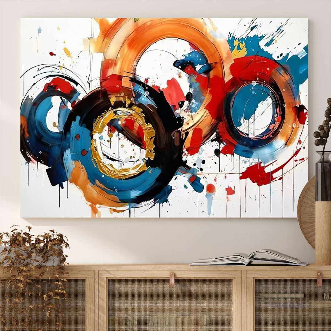 The Abstract Wall Art Rings Canvas Print, with its bold and colorful circular strokes, adorns the wall, epitomizing contemporary design.