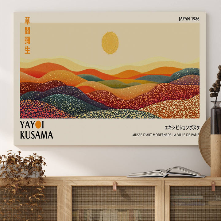 The Yayoi Kusama Wall Art Print is a vibrant abstract landscape canvas featuring colorful dotted hills and a sun, showcasing Japanese art and signed by Yayoi Kusama. It is dated Japan 1986.