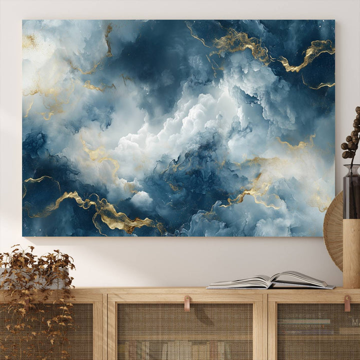 Modern living room featuring the Large Abstract Print - Luxe Blue and Gold Abstract Canvas Wall Art that showcases a bold cloudscape, perfect for modern home decor.